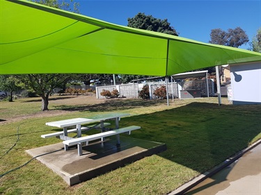 Uralla Swimming Pool - Benches and grass BBQ area