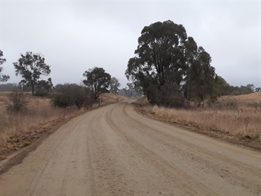 Kliendienst Road heavy patching stabilised gravel surface awaiting dry weather to bitumen seal.jpg